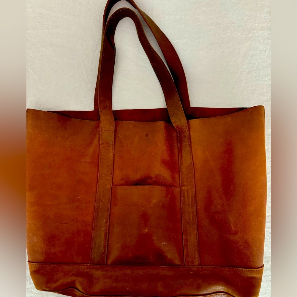 Nicely worn in cognac leather tote.
